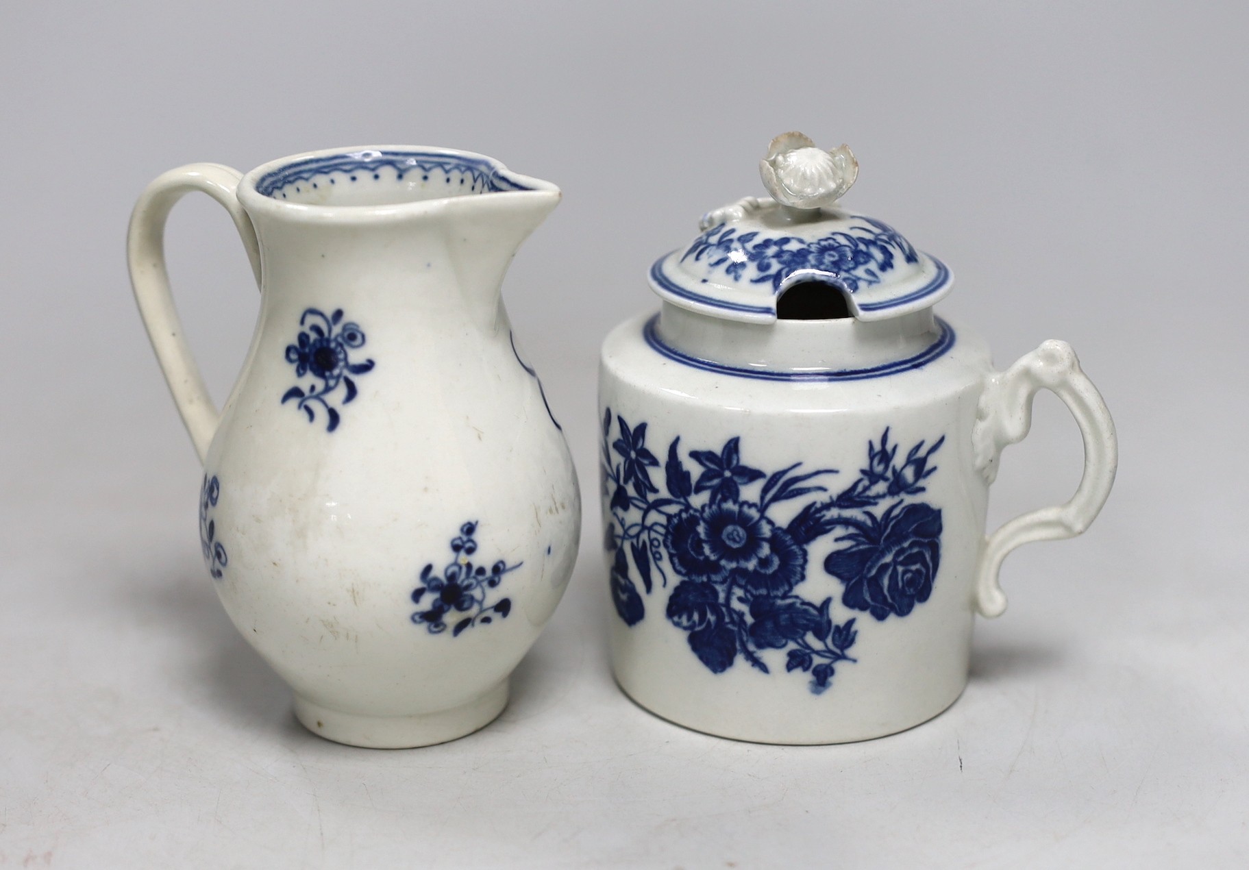 An 18th century Caughley rare sparrowbeak jug painted with the Waiting Chinaman pattern, handle repaired and a Caughley mustard pot and cover with Three Flowers, jug 9cms high